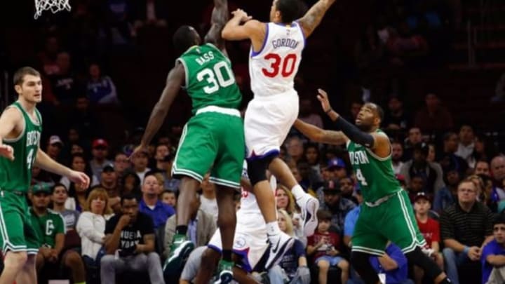 Oct 16, 2014; Philadelphia, PA, USA; Philadelphia 76ers forward Drew Gordon (30) scores on a hook shot past Boston Celtics forward Brandon Bass (30) during the second half at Wells Fargo Center. The Celtics defeated the Sixers 111 to 91. Mandatory Credit: Bill Streicher-USA TODAY Sports