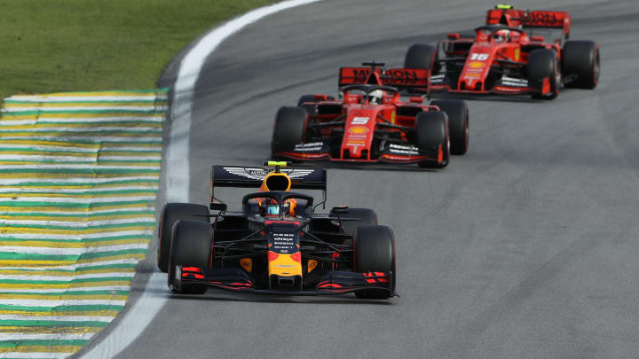 SAO PAULO, BRAZIL – NOVEMBER 17: Alexander Albon of Thailand driving the (23) Aston Martin Red Bull Racing RB15 leads Sebastian Vettel of Germany driving the (5) Scuderia Ferrari SF90 and Charles Leclerc of Monaco driving the (16) Scuderia Ferrari SF90 (Photo by Robert Cianflone/Getty Images)
