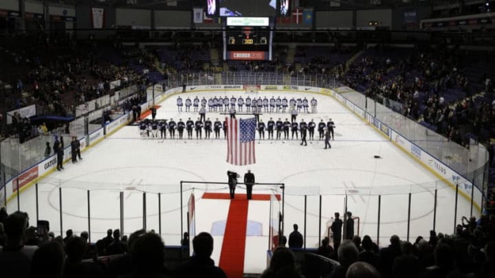 VICTORIA , BC - DECEMBER 26: Team United States stands along the blue line as their countries flag is raised following a victory over Team Slovakia at the IIHF World Junior Championships at the Save-on-Foods Memorial Centre on December 26, 2018 in Victoria, British Columbia, Canada. (Photo by Kevin Light/Getty Images)