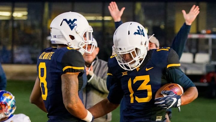 Nov 5, 2016; Morgantown, WV, USA; West Virginia Mountaineers cornerback Rasul Douglas (13) celebrates with safety Kyzir White (8) after intercepting a pass during the fourth quarter against the Kansas Jayhawks at Milan Puskar Stadium. Mandatory Credit: Ben Queen-USA TODAY Sports
