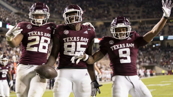 Oct 31, 2020; College Station, TX, USA; Texas A&M tight end Jalen Wydermyer (85) reacts with teammates Isaiah Spiller (28) and Hezekiah Jones (9) after a touchdown catch against Arkansas during the second half of an NCAA college football game, Saturday, Oct. 31, 2020, in College Station, Texas. Mandatory Credit: Sam Craft/Pool Photo-USA TODAY Sports