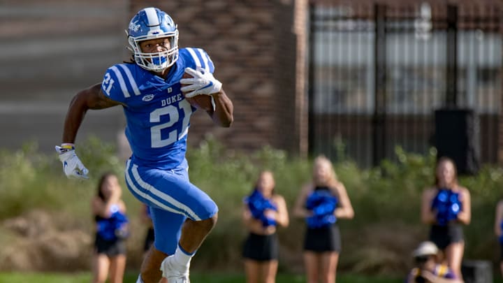 Sep 18, 2021; Durham, North Carolina, USA; Duke Blue Devils running back Mataeo Durant (21) runs the ball during the first quarter at Wallace Wade Stadium. Mandatory Credit: William Howard-USA TODAY Sports