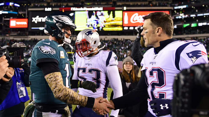 PHILADELPHIA, PA – NOVEMBER 17: Carson Wentz #11 of the Philadelphia Eagles and Tom Brady #12 of the New England Patriots shake hands after the game at Lincoln Financial Field on November 17, 2019, in Philadelphia, Pennsylvania. The Patriots defeated the Eagles 17-10. (Photo by Corey Perrine/Getty Images)