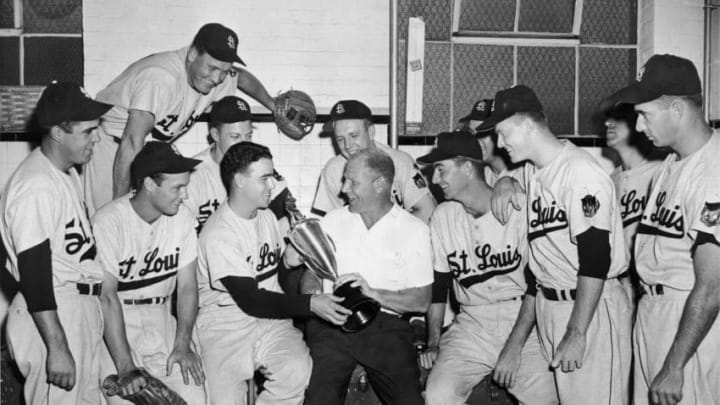 American baseball player Ned Garver, pitcher for the St. Louis Browns, and his teammates present a trophy to Browns’ President Bill Veeck (1914 – 1986) in the dressing room at Fenway Park, Boston, Massachusetts, June 10. 1952. Veeck had just fired manager Rogers Hornsby and the players were showing him their appreciation. (Photo by Bruce Bennett Studios/Getty Images)
