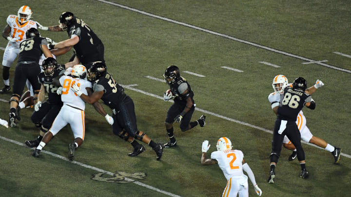 Dec 12, 2020; Nashville, Tennessee, USA; Vanderbilt Commodores running back Keyon Henry-Brooks (21) runs for a first down during the second half against the Tennessee Volunteers at Vanderbilt Stadium. Mandatory Credit: Christopher Hanewinckel-USA TODAY Sports