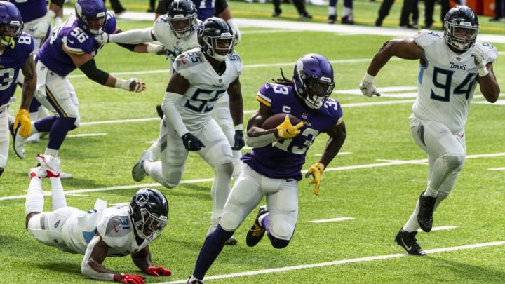 MINNEAPOLIS, MN – SEPTEMBER 27: Dalvin Cook #33 of the Minnesota Vikings runs with the ball for a touchdown in the first quarter of the game against the Tennessee Titans at U.S. Bank Stadium on September 27, 2020 in Minneapolis, Minnesota. (Photo by Stephen Maturen/Getty Images)
