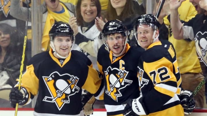 Apr 13, 2016; Pittsburgh, PA, USA; Pittsburgh Penguins left wing Conor Sheary (43) and right wing Patric Hornqvist (72) celebrate with center Sidney Crosby (87) after Crosby scored a goal against in game one of the first round of the 2016 Stanley Cup Playoffs at the CONSOL Energy Center. Mandatory Credit: Charles LeClaire-USA TODAY Sports