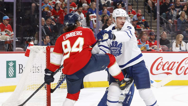 SUNRISE, FL – APRIL 10: Luke Schenn #2 of the Toronto Maple Leafs defends against Ryan Lomberg #94 of the Florida Panthers at the FLA Live Arena on April 10, 2023 in Sunrise, Florida. (Photo by Joel Auerbach/Getty Images)