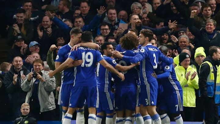 Chelsea players celebrates after Chelsea's Nigerian midfielder Victor Moses scored their second goal during the English Premier League football match between Chelsea and Tottenham Hotspur at Stamford Bridge in London on November 26, 2016. / AFP / Ian KINGTON / RESTRICTED TO EDITORIAL USE. No use with unauthorized audio, video, data, fixture lists, club/league logos or 'live' services. Online in-match use limited to 75 images, no video emulation. No use in betting, games or single club/league/player publications. / (Photo credit should read IAN KINGTON/AFP/Getty Images)