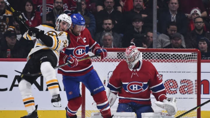 MONTREAL, QC - NOVEMBER 05: Goaltender Carey Price #31 of the Montreal Canadiens makes a pad save near teammate Shea Weber #6 and Patrice Bergeron #37 of the Boston Bruins during the second period at the Bell Centre on November 5, 2019 in Montreal, Canada. (Photo by Minas Panagiotakis/Getty Images)