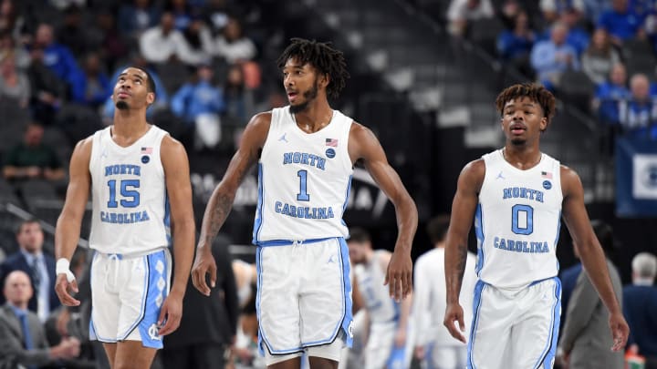 LAS VEGAS, NEVADA – DECEMBER 21: Garrison Brooks #15, Leaky Black #1 and Anthony Harris #0 of the North Carolina Tar Heels walk back on the court after a timeout in their game against the UCLA Bruins during the CBS Sports Classic at T-Mobile Arena on December 21, 2019 in Las Vegas, Nevada. The Tar Heels defeated the Bruins 74-64. (Photo by Ethan Miller/Getty Images)