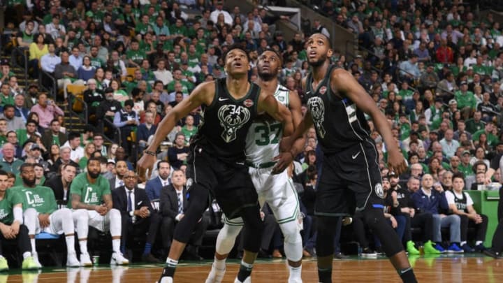 BOSTON, MA - APRIL 24: Giannis Antetokounmpo #34 of the Milwaukee Bucks Semi Ojeleye #37 of the Boston Celtics and Khris Middleton #22 of the Milwaukee Bucks box out during Game Five of Round One of the 2018 NBA Playoffs on April 24, 2018 at the TD Garden in Boston, Massachusetts. NOTE TO USER: User expressly acknowledges and agrees that, by downloading and or using this photograph, User is consenting to the terms and conditions of the Getty Images License Agreement. Mandatory Copyright Notice: Copyright 2018 NBAE (Photo by Brian Babineau/NBAE via Getty Images)