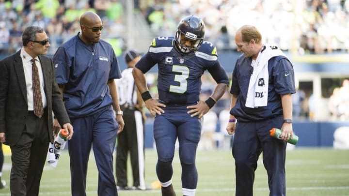 Sep 25, 2016; Seattle, WA, USA; Seattle Seahawks quarterback Russell Wilson (3) reacts after being injured in the third quarter in a game against the San Francisco 49ers at CenturyLink Field. The Seahawks won 37-18. Mandatory Credit: Troy Wayrynen-USA TODAY Sports