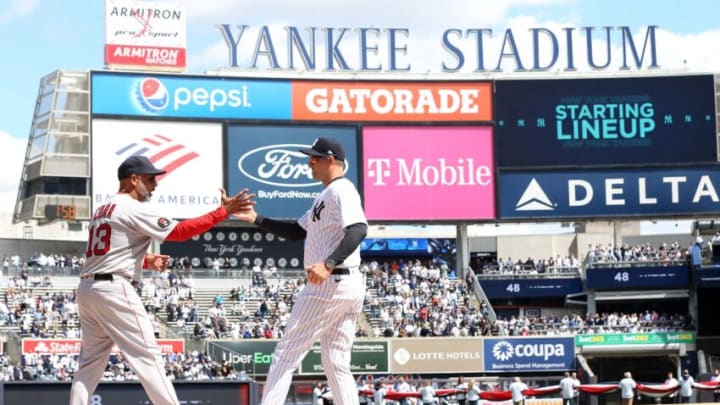 Red Sox manager Alex Cora and Yankee manager Aaron Boone shake hands prior to start of opening day game at Yankee Stadium April 8, 2022.Yankees Opening Day