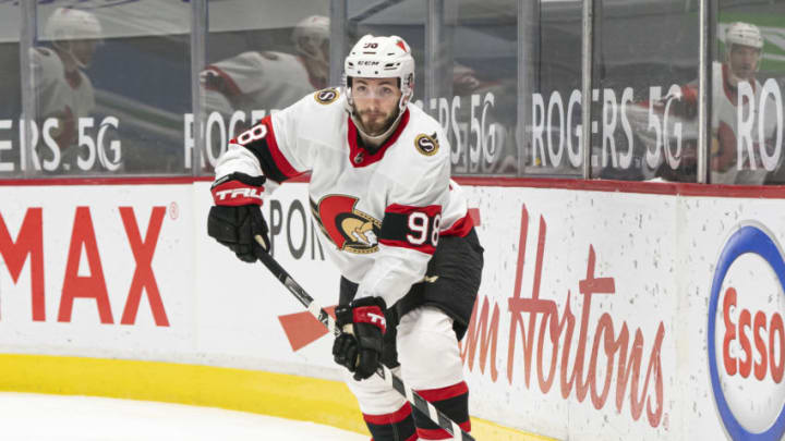 VANCOUVER, BC - APRIL 22: Victor Mete #98 of the Ottawa Senators passes the puck during NHL action against the Vancouver Canucks at Rogers Arena on April 22, 2021 in Vancouver, Canada. (Photo by Rich Lam/Getty Images)