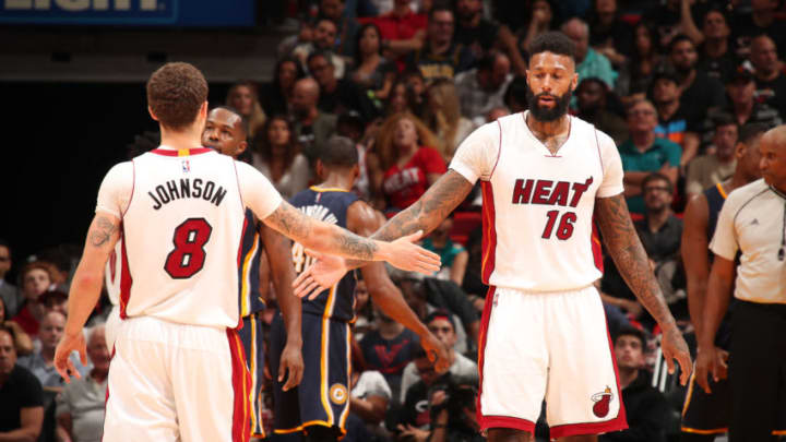 MIAMI, FL - FEBRUARY 25: Tyler Johnson #8 and James Johnson #16 of the Miami Heat high-five during a game against the Indiana Pacers. Copyright 2017 NBAE (Photo by Issac Baldizon/NBAE via Getty Images)