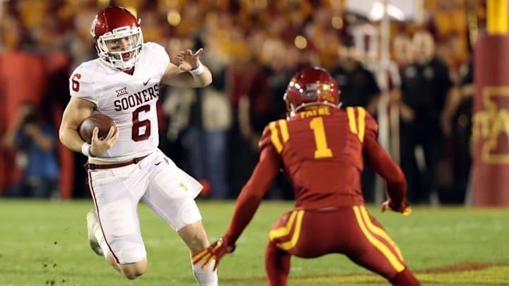 Nov 3, 2016; Ames, IA, USA; Oklahoma Sooners quarterback Baker Mayfield (6) looks for running room before being tackled by Iowa State Cyclones defensive back D