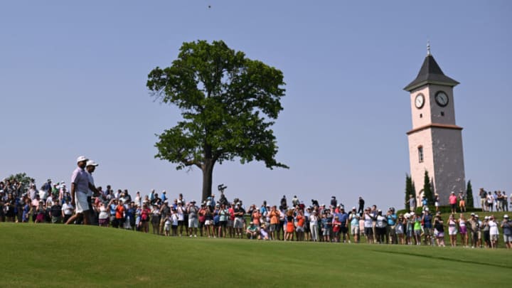 May 18, 2022; Tulsa, Oklahoma, USA; Tiger Woods and Anirban Lahiri walk the 5th fairway during a practice round for the PGA Championship golf tournament at Southern Hills Country Club. Mandatory Credit: Orlando Ramirez-USA TODAY Sports