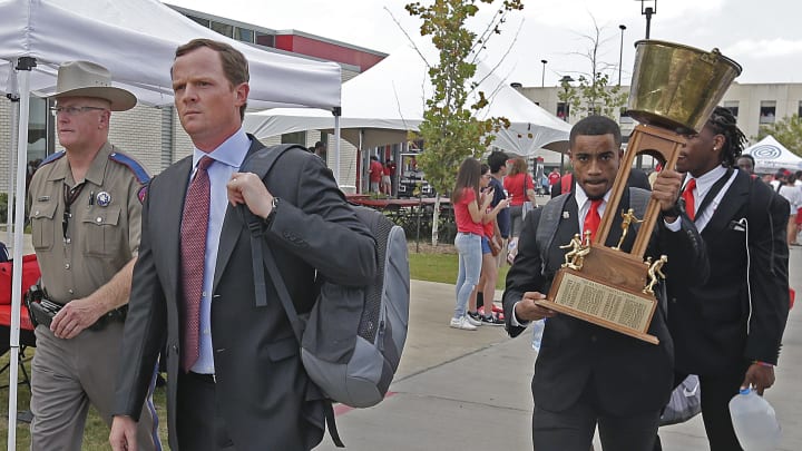 HOUSTON, TX – SEPTEMBER 16: Head coach Major Applewhite walks the Cougar Walk while Dillon Birden #25 of the Houston Cougars carries the Bayou Bucket before playing against the Rice Owls at TDECU Stadium on September 16, 2017, in Houston, Texas. (Photo by Thomas B. Shea/Getty Images)