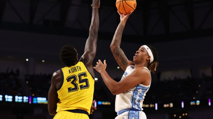 FORT WORTH, TEXAS - MARCH 17: Armando Bacot #5 of the North Carolina Tar Heels shoots the ball as Kur Kuath #35 of the Marquette Golden Eagles defends in the first half of the game during the first round of the 2022 NCAA Men's Basketball Tournament at Dickies Arena on March 17, 2022 in Fort Worth, Texas. (Photo by Tom Pennington/Getty Images)