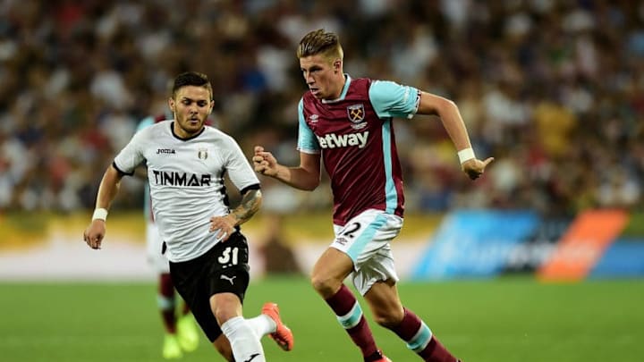 LONDON, ENGLAND - AUGUST 27: Reece Burke of West Ham advances under pressure from Alexandra Ionita of FC Astra Giurgiu during the UEFA Europa League match between West Ham United and FC Astra Giurgiu at the Olympic Stadium on August 27, 2016 in London, England. (Photo by Alex Broadway/Getty Images)