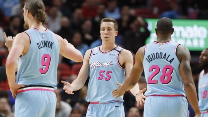 Duncan Robinson #55 of the Miami Heat celebrates with Kelly Olynyk #9 and Andre Iguodala #28 during the first half (Photo by Michael Reaves/Getty Images)