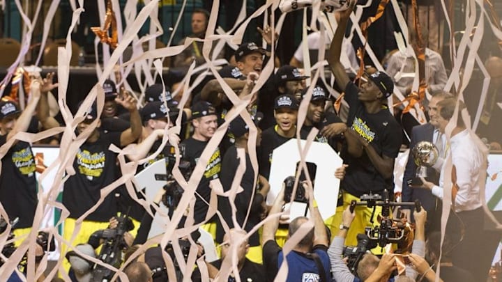 March 12, 2016; Las Vegas, NV, USA; Oregon Ducks players hoist the championship trophy after the championship game of the Pac-12 Conference tournament against the Utah Utes at MGM Grand Garden Arena. The Ducks defeated the Utes 88-57. Mandatory Credit: Kyle Terada-USA TODAY Sports