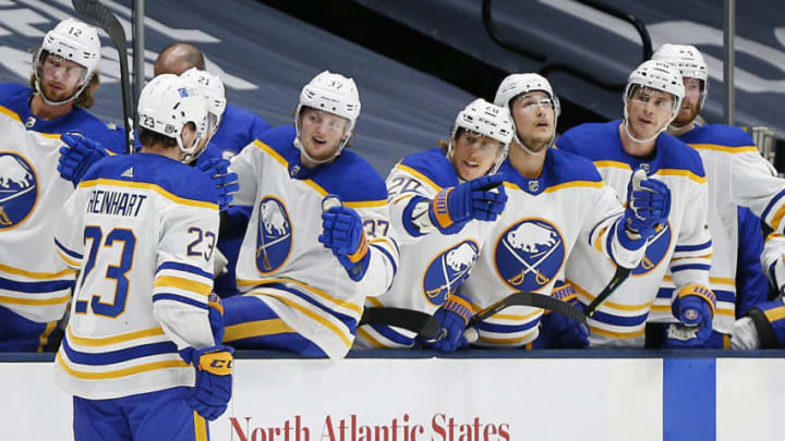 Feb 22, 2021; Uniondale, New York, USA; Buffalo Sabres center Sam Reinhart (23) is congratulated after scoring a goal against the New York Islanders during the third period at Nassau Veterans Memorial Coliseum. Mandatory Credit: Andy Marlin-USA TODAY Sports