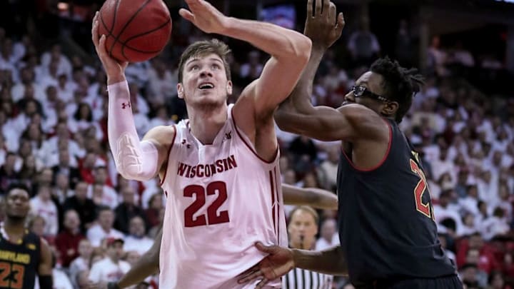 MADISON, WISCONSIN - FEBRUARY 01: Ethan Happ #22 of the Wisconsin Badgers attempts a shot while being guarded by Jalen Smith #25 of the Maryland Terrapins in the first half at the Kohl Center on February 01, 2019 in Madison, Wisconsin. (Photo by Dylan Buell/Getty Images)