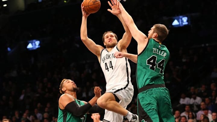 Jan 4, 2016; Brooklyn, NY, USA; Boston Celtics center Tyler Zeller (44) keeps Brooklyn Nets guard Bojan Bogdanovic (44) from the net during the second quarter at Barclays Center. Mandatory Credit: Anthony Gruppuso-USA TODAY Sports