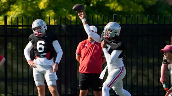 Aug 11, 2022; Columbus, OH, USA; Ohio State Buckeyes quarterback C.J. Stroud (7) throws in front of quarterback Kyle McCord (6) during football camp at the Woody Hayes Athletic Center. Mandatory Credit: Adam Cairns-The Columbus DispatchOhio State Football Camp