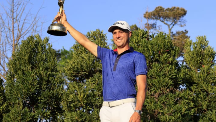PONTE VEDRA BEACH, FLORIDA - MARCH 14: Justin Thomas of the United States celebrates with the trophy after winning during the final round of THE PLAYERS Championship on THE PLAYERS Stadium Course at TPC Sawgrass on March 14, 2021 in Ponte Vedra Beach, Florida. (Photo by Sam Greenwood/Getty Images)
