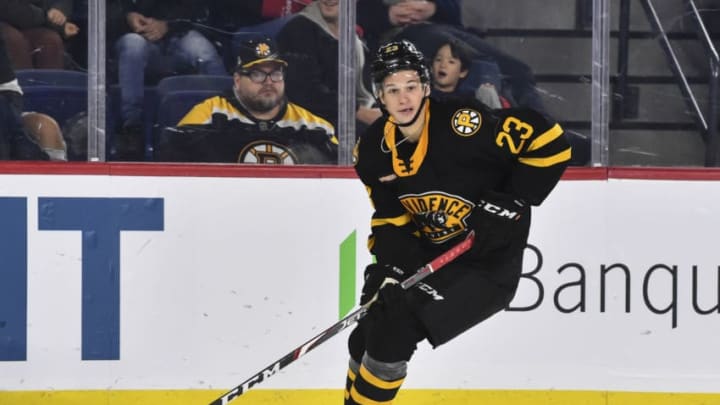 LAVAL, QC - OCTOBER 16: Jack Studnicka #23 of the Providence Bruins skates the puck against the Laval Rocket at Place Bell on October 16, 2019 in Laval, Canada. The Laval Rocket defeated the Providence Bruins 5-4 in a shoot-out. (Photo by Minas Panagiotakis/Getty Images)