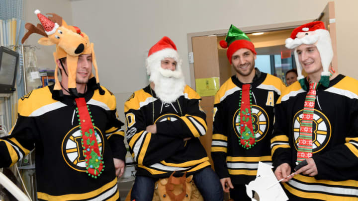 BOSTON, MA - DECEMBER 11: Boston Bruins (L to R) Tim Schallers, Anders Bjork, Patrie Bergeron, and Noel Acciarivisit the kids Boston Children's Hospital December 11, 2017 in Boston, Massachusetts. (Photo by Darren McCollester/Getty Images for Boston Children's Hospital)