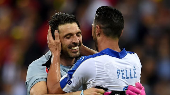 Gianluigi Buffon of Italy (L) celebrates with his team mate Leonardo Bonucci 2-0 win after the UEFA EURO 2016 Group E match between Belgium and Italy at Stade des Lumieres on June 13, 2016 in Lyon, France.