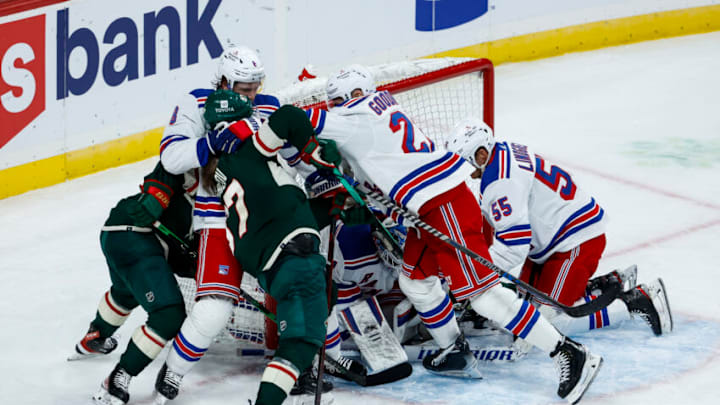 ST PAUL, MN - OCTOBER 13: Members of the New York Rangers and the Minnesota Wild get into a scrum near the Rangers net in the second period of the game at Xcel Energy Center on October 13, 2022 in St Paul, Minnesota. (Photo by David Berding/Getty Images)