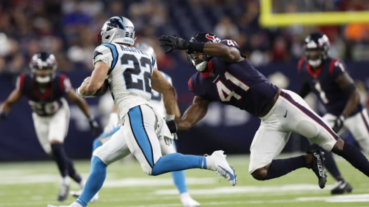 HOUSTON, TEXAS - SEPTEMBER 23: Zach Cunningham #41 of the Houston Texans tries to catch Christian McCaffrey #22 of the Carolina Panthers during a first quarter run at NRG Stadium on September 23, 2021 in Houston, Texas. (Photo by Tim Warner/Getty Images)