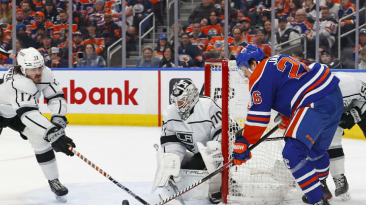 Los Angeles Kings forward Zack MacEwen (17) blocks a shot by Edmonton Oilers forward Mattias Janmark (26) Mandatory Credit: Perry Nelson-USA TODAY Sports