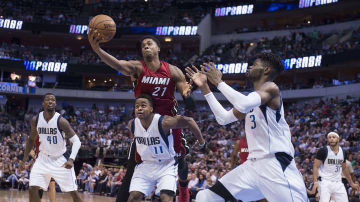 Feb 27, 2017; Dallas, TX, USA; Miami Heat center Hassan Whiteside (21) grabs a rebound over Dallas Mavericks guard Yogi Ferrell (11) as forward Harrison Barnes (40) and forward Nerlens Noel (3) look on during the second half at the American Airlines Center. The Mavericks defeated the Heat 96-89. Mandatory Credit: Jerome Miron-USA TODAY Sports