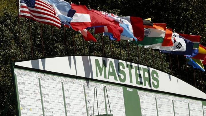 Apr 7, 2016; Augusta, GA, USA; Flags blow in the wind on top of the main scoreboard along the 1st hole during the first round of the 2016 The Masters golf tournament at Augusta National Golf Club. Mandatory Credit: Rob Schumacher-USA TODAY Sports