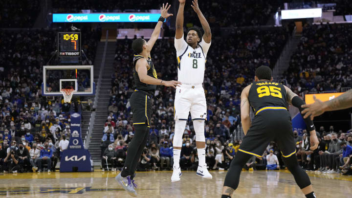 Rudy Gay #8 of the Utah Jazz shoots a three-point shot over Jordan Poole #3 of the Golden State Warriors during a game in January 2022. (Photo by Thearon W. Henderson/Getty Images)