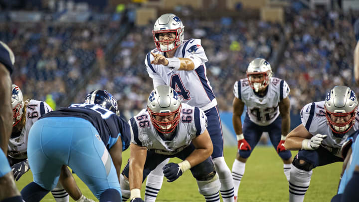NASHVILLE, TN – AUGUST 17: Jarrett Stidham #4 of the New England Patriots points out the blocking assignment during a week two preseason game against the Tennessee Titans at Nissan Stadium on August 17, 2019 in Nashville, Tennessee. The Patriots defeated the Titans 22-17. (Photo by Wesley Hitt/Getty Images)