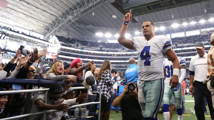Nov 20, 2016; Arlington, TX, USA; Dallas Cowboys quarterback Dak Prescott (4) celebrates as he heads to the locker room after the game against the Baltimore Ravens at AT&T Stadium. The Cowboys beat the Raven 24-17. Mandatory Credit: Matthew Emmons-USA TODAY Sports