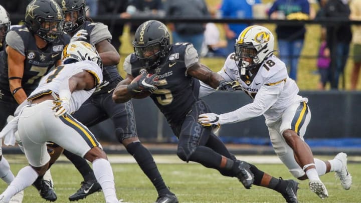 NASHVILLE, TENNESSEE - OCTOBER 19: Ke'Shawn Vaughn #5 of the Vanderbilt Commodores is pursued by Joshuah Bledsoe #18 of the Missouri Tigers during the first half at Vanderbilt Stadium on October 19, 2019 in Nashville, Tennessee. (Photo by Frederick Breedon/Getty Images)