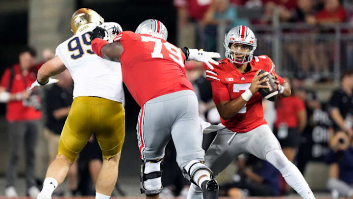 Sep 3, 2022; Columbus, Ohio, USA; Ohio State Buckeyes quarterback C.J. Stroud (7) avoids pressure from Notre Dame Fighting Irish defensive lineman Rylie Mills (99) as Ohio State offensive lineman Dawand Jones (79) blocks in the third quarter at Ohio Stadium. Mandatory Credit: Kyle Robertson-USA TODAY Sports Sep 3, 2022; Columbus, Ohio, USA; Ohio State Buckeyes quarterback C.J. Stroud (7) avoids pressure from Notre Dame Fighting Irish defensive lineman Rylie Mills (99) as Ohio State offensive lineman Dawand Jones (79) blocks in the third quarter at Ohio Stadium. Mandatory Credit: Kyle Robertson-USA TODAY Sports
