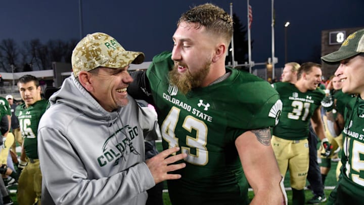 FT. COLLINS, CO - NOVEMBER 18: Colorado State head coach Mike Bobo, left, and Colorado State Rams linebacker Evan Colorito #43 celebrate on the field after defeating the San Jose Spartans 42-14 at Sonny Lubick Field at Colorado State Stadium November 18, 2017. (Photo by Andy Cross/The Denver Post via Getty Images)