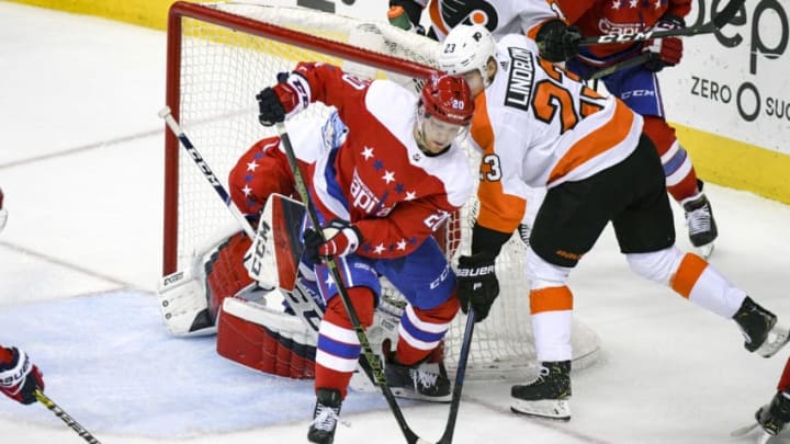 WASHINGTON, DC - JANUARY 08: Washington Capitals center Lars Eller (20) defends the goal in the third period on a shot by Philadelphia Flyers left wing Oskar Lindblom (23) January 8, 2019, at the Capital One Arena in Washington, D.C. (Photo by Mark Goldman/Icon Sportswire via Getty Images)