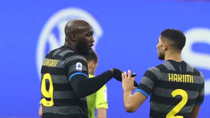 MILAN, ITALY - JANUARY 30: Romelu Lukaku (L) of FC Internazionale celebrates his second goal with his team-mate Achraf Hakimi (R) during the Serie A match between FC Internazionale and Benevento Calcio at Stadio Giuseppe Meazza on January 30, 2021 in Milan, Italy. (Photo by Marco Luzzani/Getty Images)