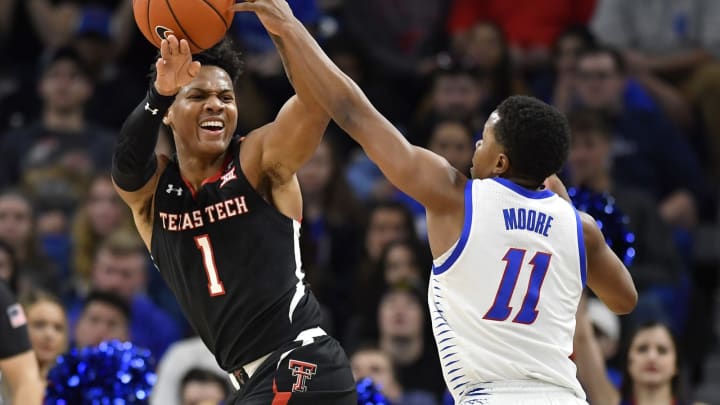 Terrence Shannon Jr. #1 of the Texas Tech Red Raiders pass is blocked by Charlie Moore #11 of the DePaul Blue Demons (Photo by Quinn Harris/Getty Images)