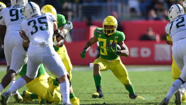 SANTA CLARA, CA - DECEMBER 31: CJ Verdell #34 of the Oregon Ducks carries the ball against the Michigan State Spartans during the first half of the Redbox Bowl at Levi's Stadium on December 31, 2018 in Santa Clara, California. (Photo by Thearon W. Henderson/Getty Images)